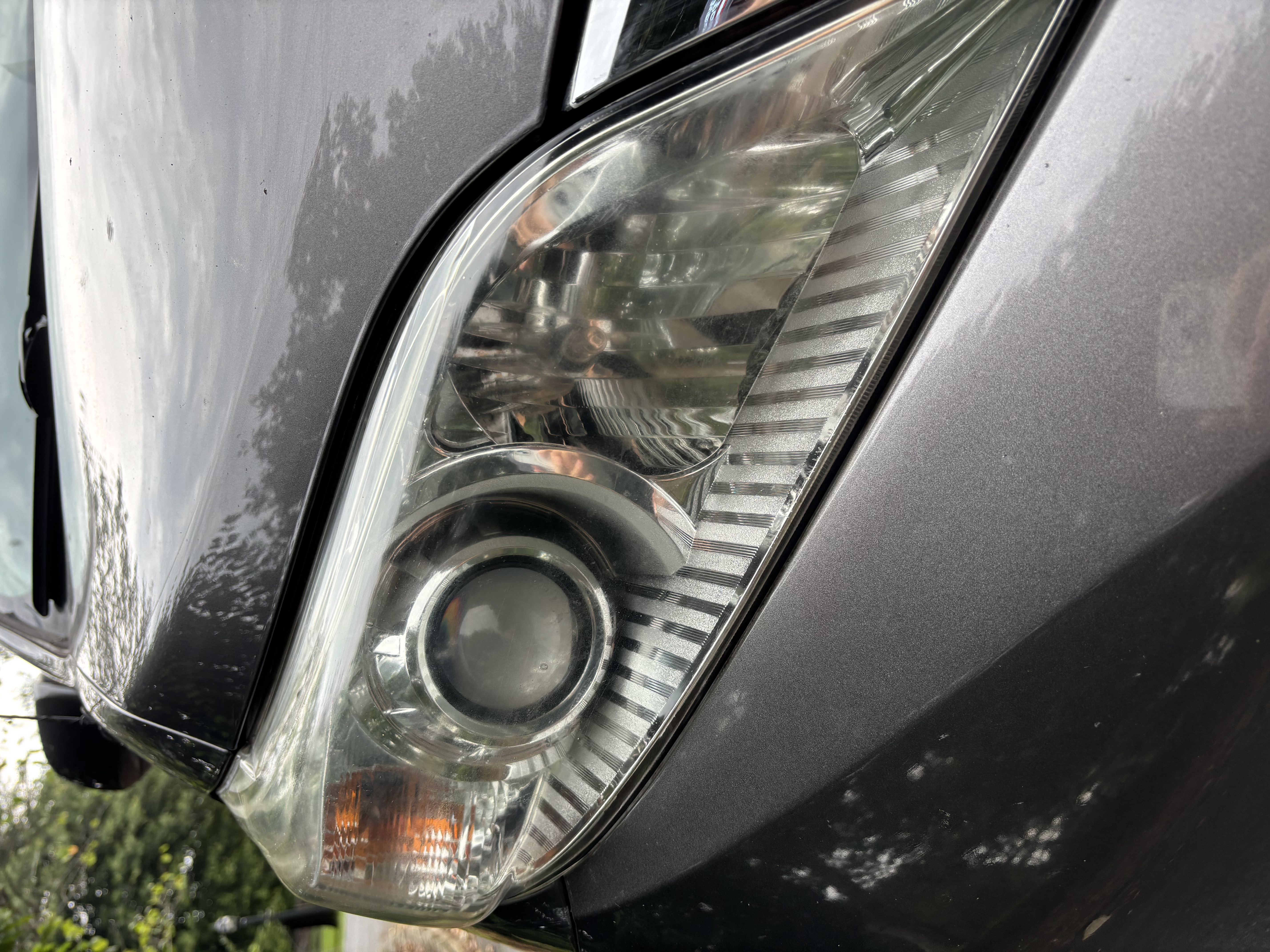 Before restoration — yellowed headlight